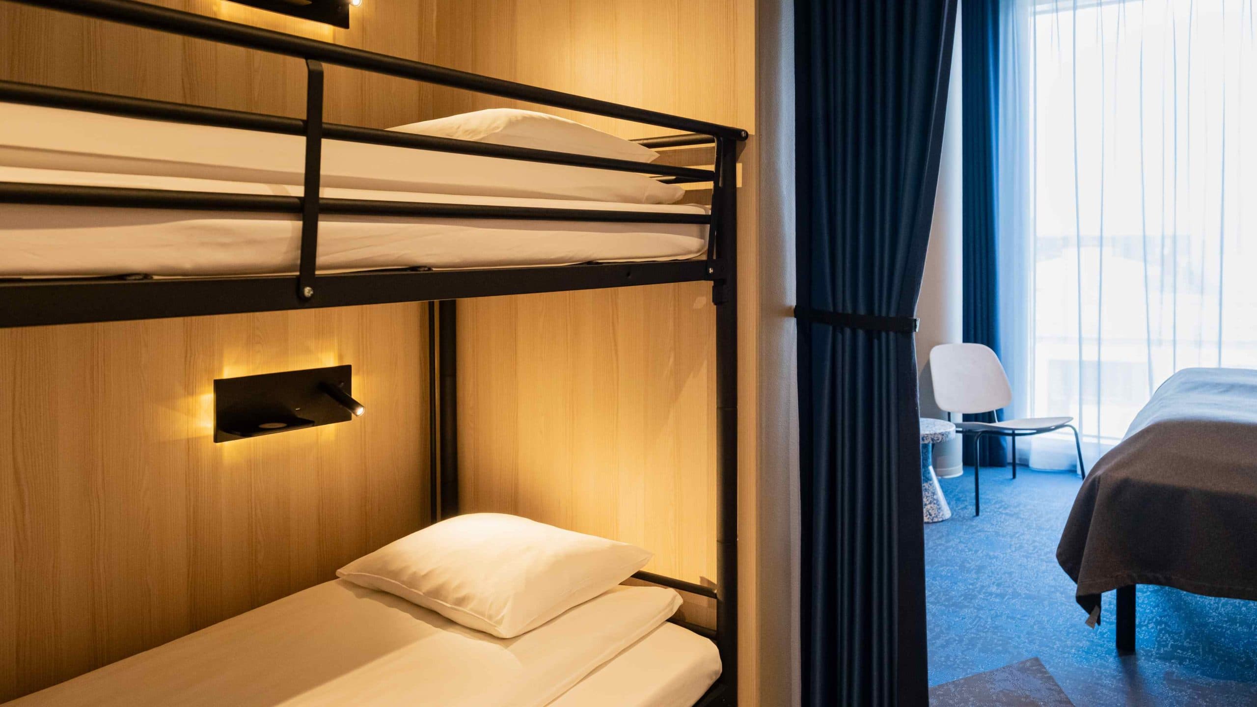 Picture of the family room where you can see the double bed and the bunk bed